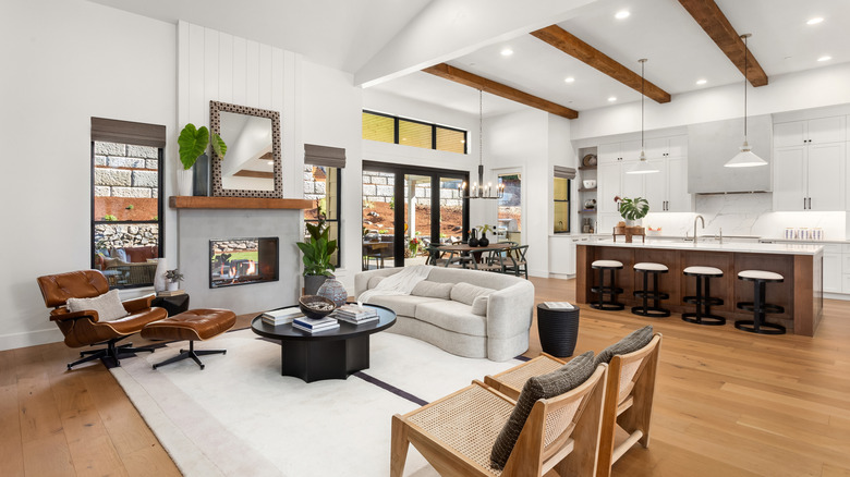 Open concept home, with living room, kitchen, and dining room