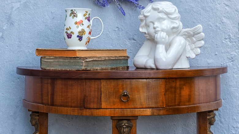 A close up of a wooden vintage side table.
