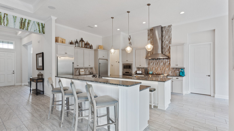 large kitchen with white shaker cabinets