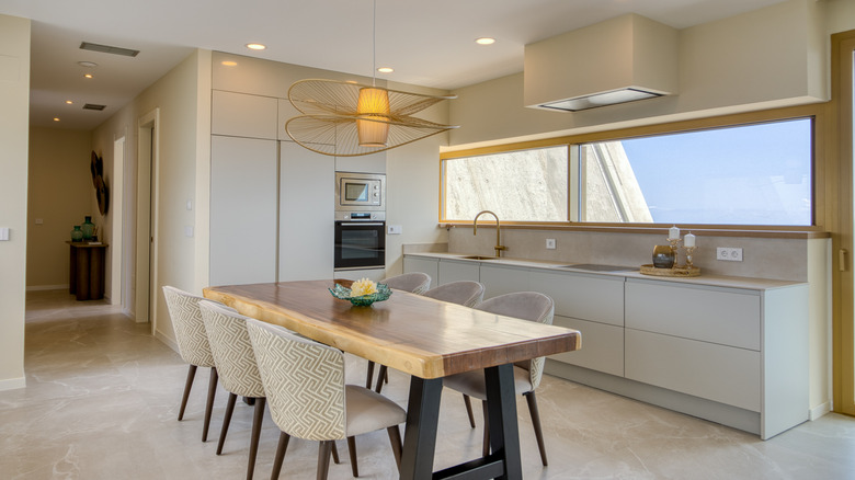 Modern kitchen and dining area with large window