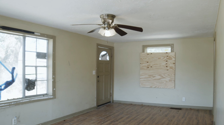 Boarded window in living room