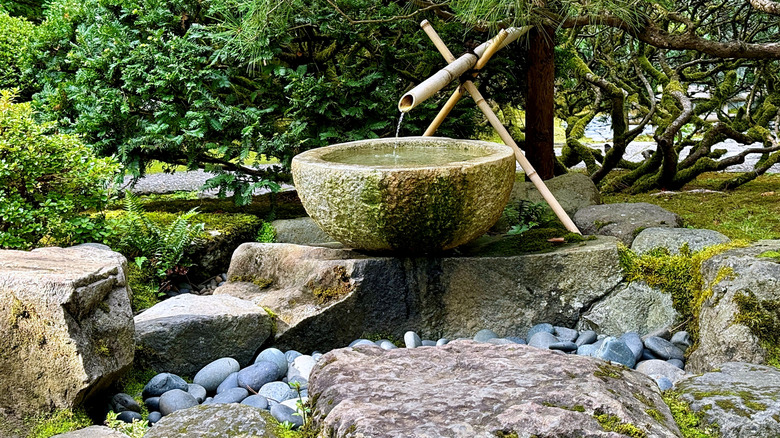 Water trickling into bowl of water feature.