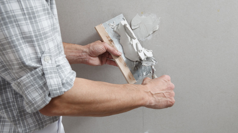 Repairing hole with plaster