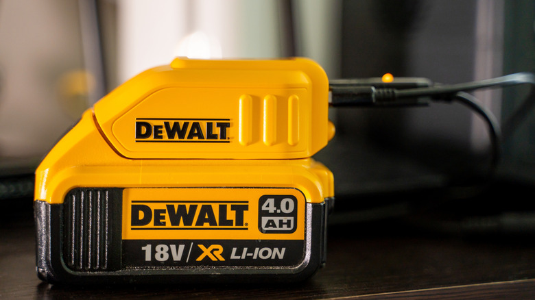 DeWalt tool battery charging on table
