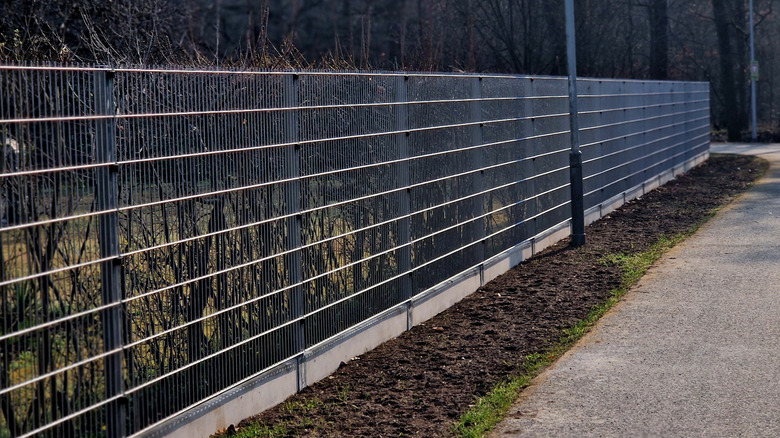 A perfectly stretched woven wire fence