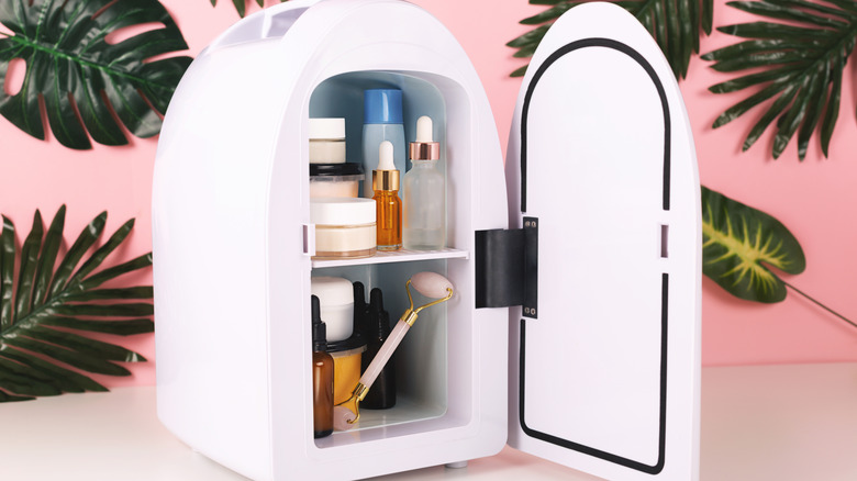 mini fridge with colorful pink background