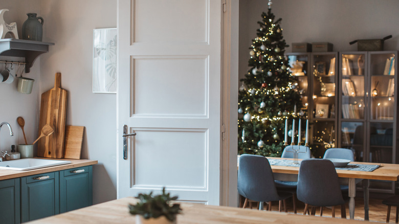 A kitchen and dining area with simplistic Christmas decor