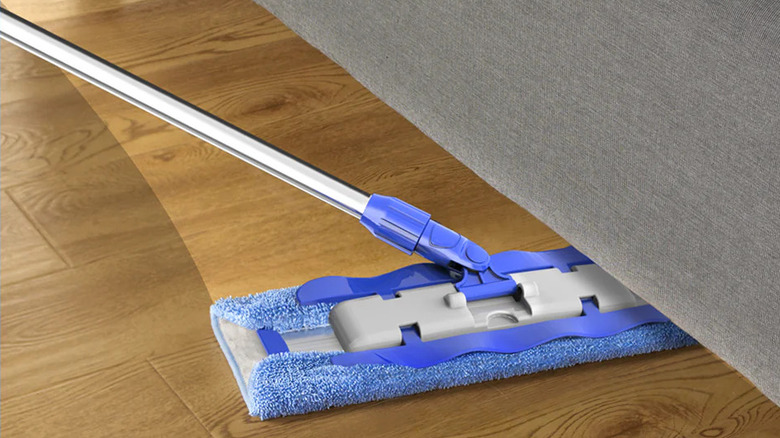 A Mr. Siga Professional Microfiber Mop cleaning a wood floor