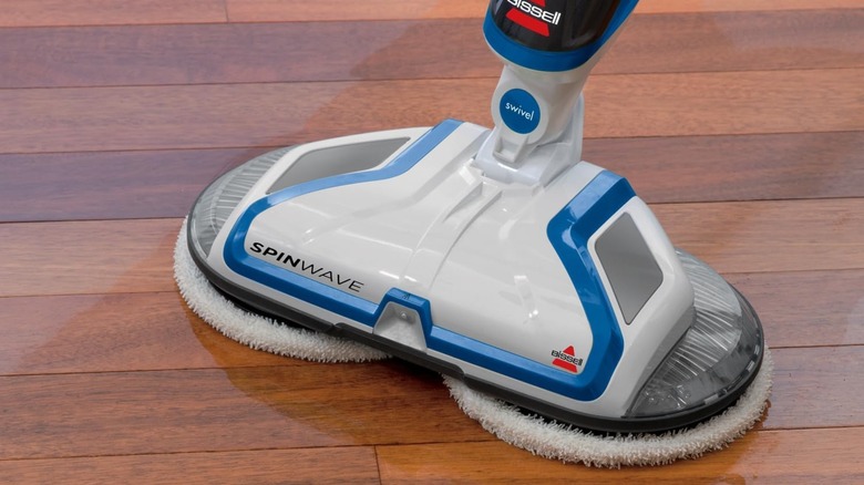 A Bissell SpinWave cleaning a wood floor