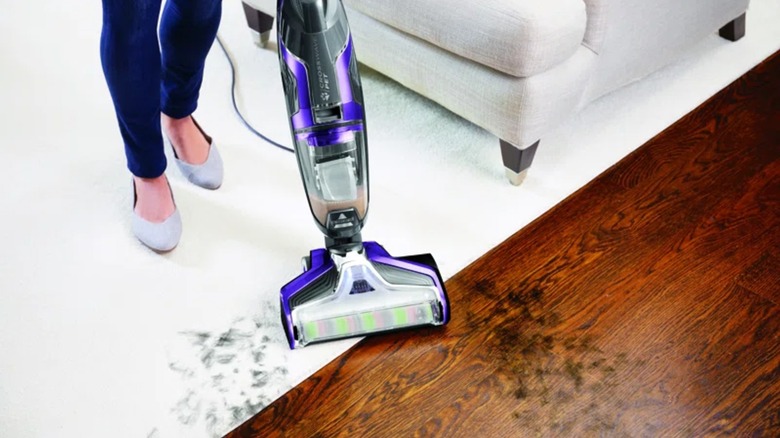 A Bissell Crosswave Pet Pro Wet Dry Vacuum cleaning a hardwood floor