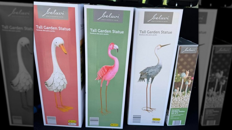 Aldi bird statues in trunk of car