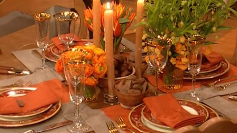 Holiday table with flowers and bowls of nuts
