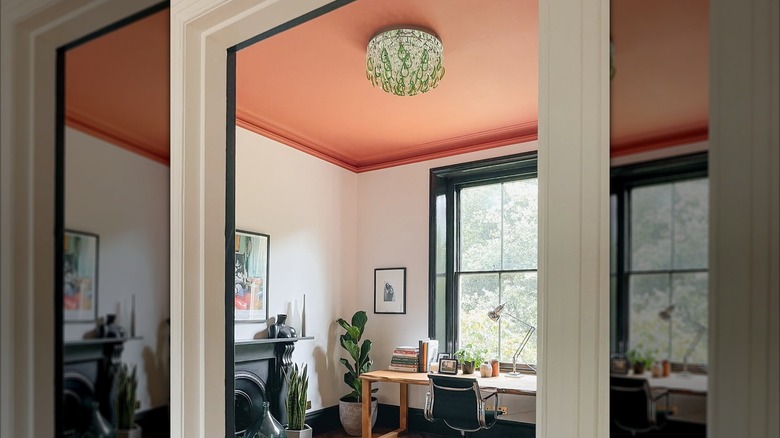 A color capped room with a dusty pink ceiling and lighter walls
