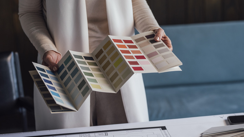 Woman selecting paint color