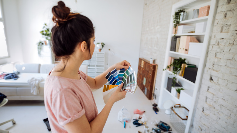 Woman looking at paint samples