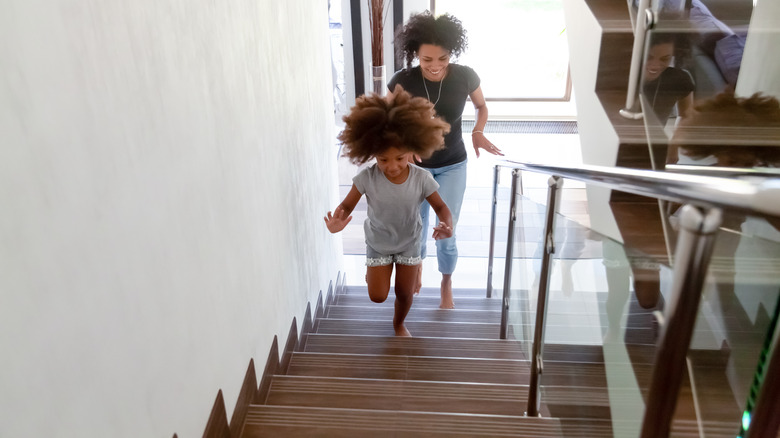 Family running up stairs