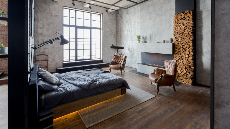 fireplace in bedroom with firewood