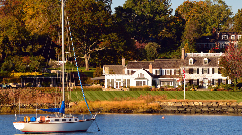yacht and riverside mansion
