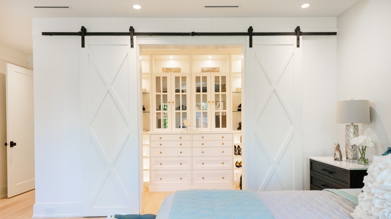 walk in closet with barn door