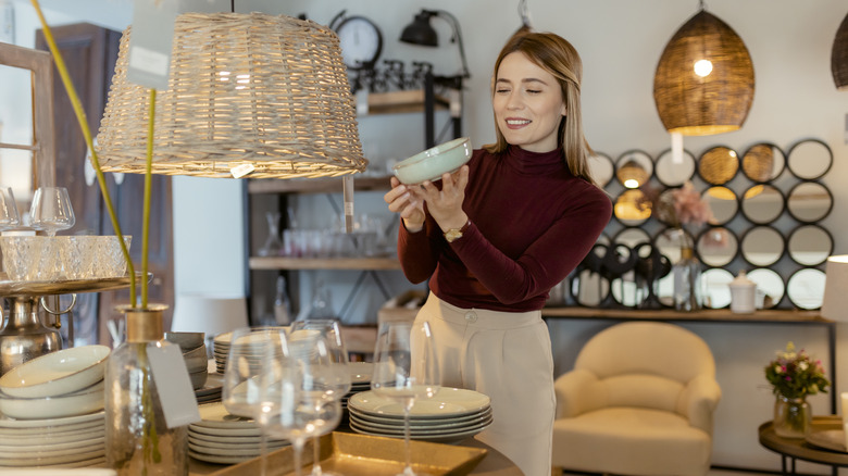 woman shopping for vintage housewares