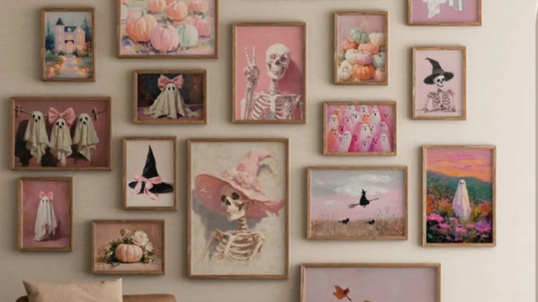 A gallery wall of cute pink Halloween art