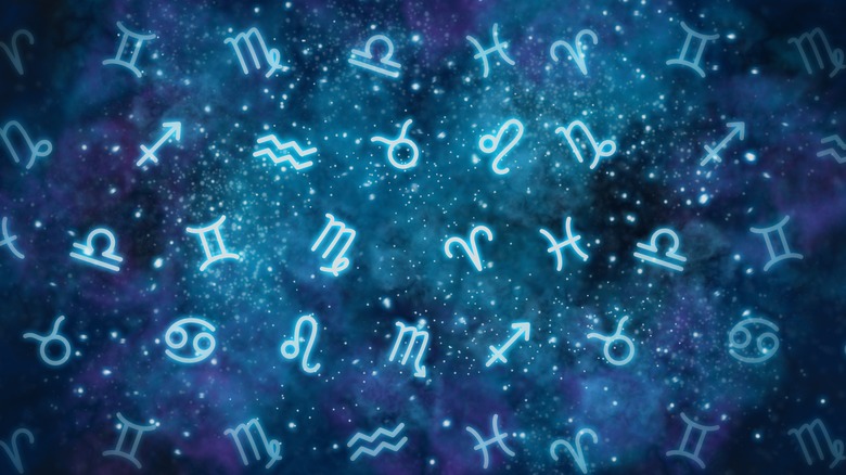 zodiac signs on a night sky background