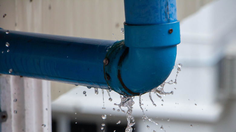 Water dripping from leaking pipe