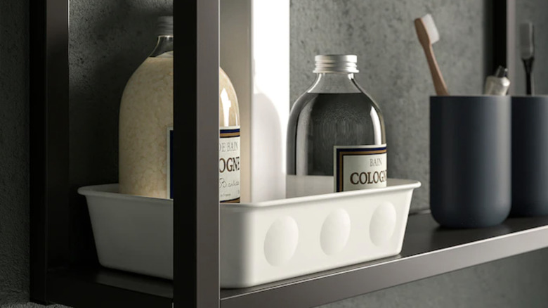 white bin on bathroom shelf
