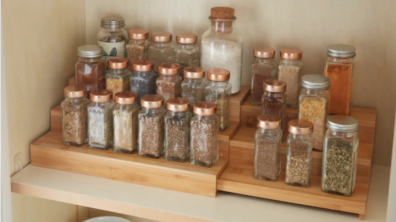 Spice jars on wood rack