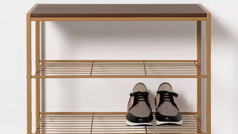 Brass shoe rack with shoes