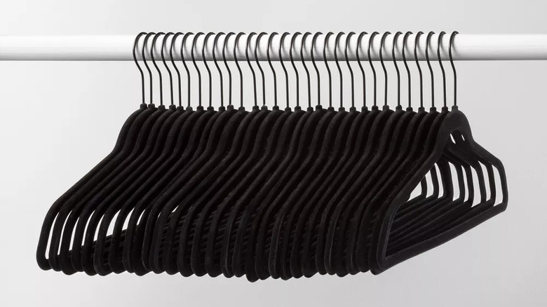 Black velvet hangers on rod