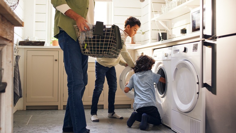 Family in laundry room