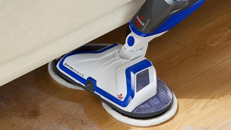 Bissell® SpinWave Corded Spin Mop Cleaner cleaning under a sofa