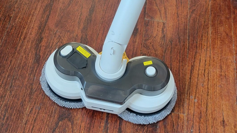a Qimedo Cordless Electric Spin Mop on the floor