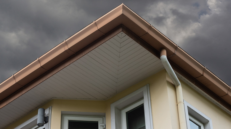 beige house and brown roof