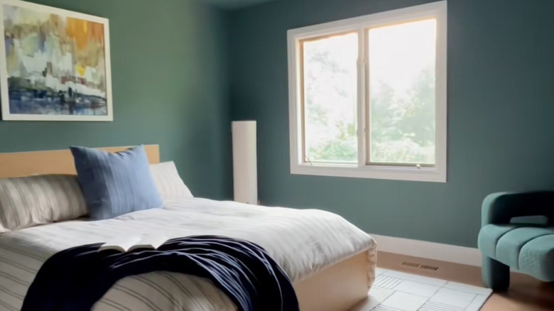 bedroom in dark blue green