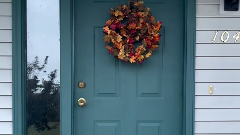 blue front door with wreath