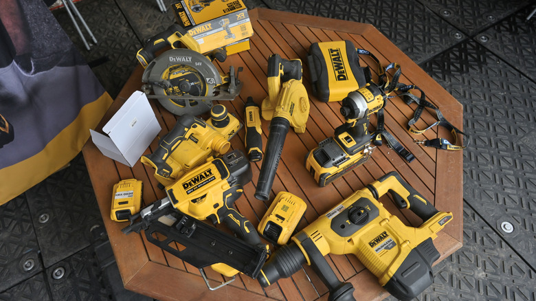 table holding variety of DeWalt tools