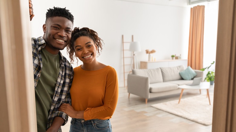couple welcoming into apartment