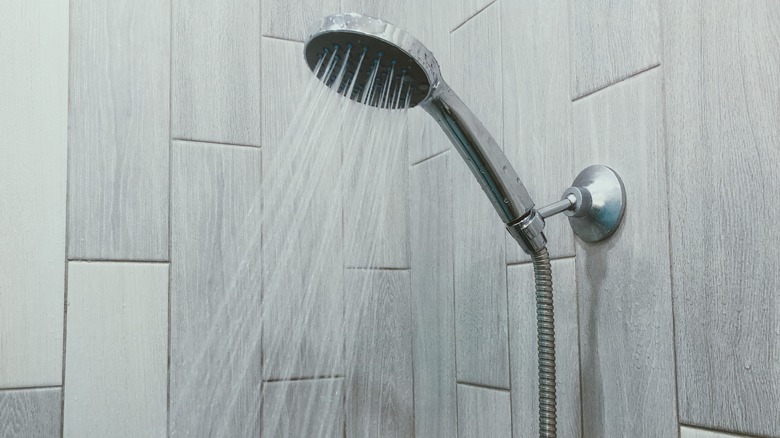 modern shower with gray tiles