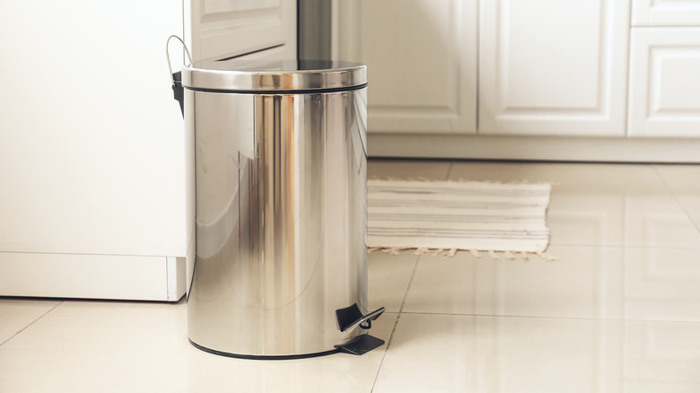 Metal trash can, white kitchen