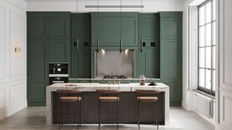 Kitchen with forest green cabinets