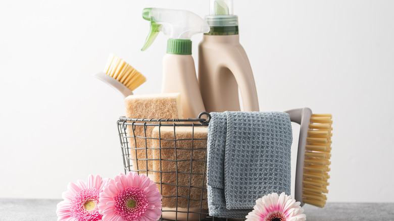 Cleaning products surrounded by flowers