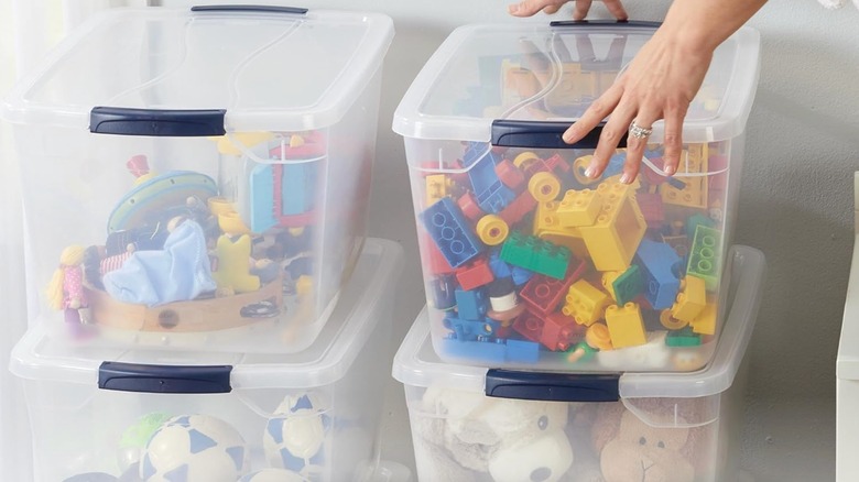 Rubbermaid Cleverstore Clear Stackable Storage Bins holding children's toys
