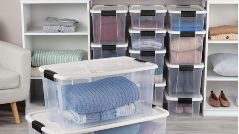 Sterilite Ultra Latching Box Storage Bins being used to hold clothes in a dressing area