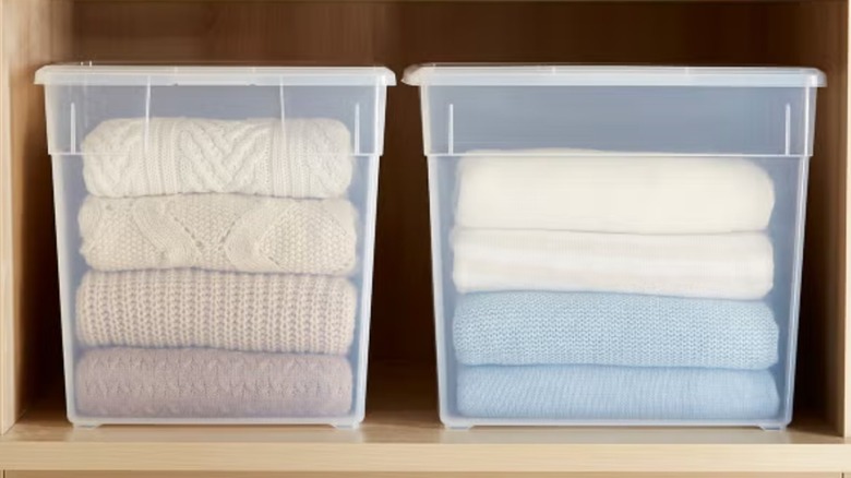 The Container Store's Our Deep Sweater Boxes sitting on a shelf and holding knitwear