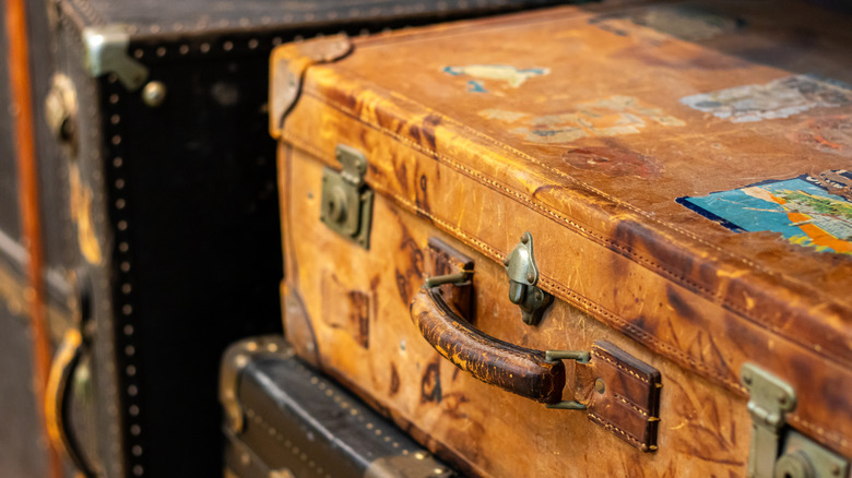 Travel stickers on a vintage leather suitcase.