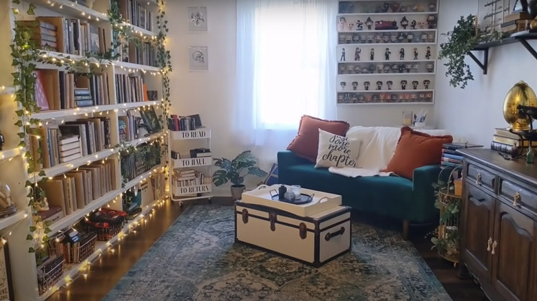 bedroom with bookcases and books