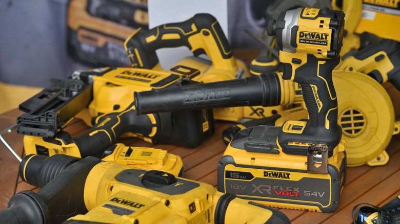 A group of DeWalt tools laying on a table