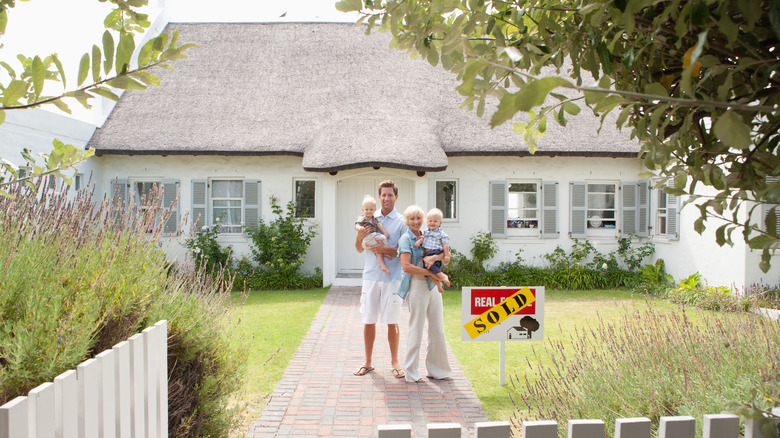 People in front of home